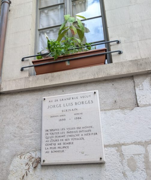 Plakkaat waarop de blinde schrijver Borges Geneve aanprijst